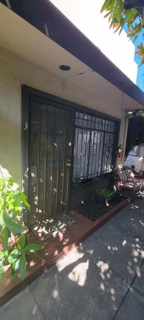 Garden patio entrance with seating outside Bowie Beauty studio